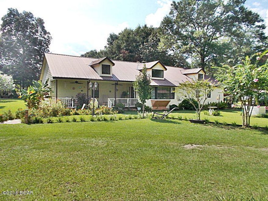 One of a kind, this home has been completely made into a very spacious bright place to live, large living room with vaulted ceilings,with an office or bonus room just off living room, opens into the kitchen with lots of cabinets and counter space. Large master bedroom and master bath,double closets, and an office just off master bedroom. There is plenty of space in the dining room, two other nice bedrooms, laundry room, there is a 12x20 screened back porch and a deck, shaded front porch, all with a metal roof installed in 2003. There is an outside workshop and carport with an additional carport, there is also a 24x36 pole barn tall enough for a motor home with a 12x36 lean too. Plenty of room for a garden on this almost 5 ac lot, the property is fenced cross/fenced with an established pasture, lots of fruit and shade trees, there is a fee/storage barn with an added lean too on both sides. According to the appraiser it is no longer considered a mobile home it has been added on to the permanent foundation, all materials inside have been updated with materials fit for a site built home. Call to view this home today.