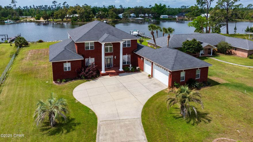 ''ELOQUENT SOUTHERN CHARM'' is what this home displays!!!!  A truly one of a kind property, bosting almost 5000 square feet on 1.29 acres that have DEEP WATER ACCESS in your back yard that is on Fanning Bayou with easy access to the Gulf of America!!!! This custom built home is large enough and offers enough to please any member of your family//// Downstairs you have a formal large dinning room, front foyer, living room with a electric fireplace to enjoy while overlooking the bayou from your living room!!! You will love the large kitchen with all stainless steel appliances and custom cherry wood cabinets! Also has gorgeous crown molding.  Ample amount of room to cook and entertain many guest for holidays and gatherings.  You also can enjoy waking up every morning with a beautiful water view from the primary bedroom that is oversized and has 3 large walk in closets. You will never run out of space. Upstairs you have 3 additional bedrooms, two full baths, and a great size game/family room that is already set up with a pool table to enjoy that the seller is leaving. Off of that game room is a 11X13 balcony that overlooks the water with a beautiful view from upstairs.  This is an exquisite property with way too many details to add. It is just one you HAVE to see to believe!!!