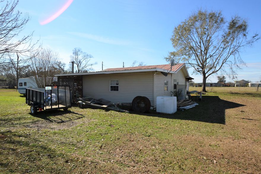 Cute one bedroom cabin sitting on 5 acres. Some fencing and cross fencing for livestock. Home has metal roof and vinyl siding, Two car carport, 20x12 craft roof is attached to home but separate entrance..

Endeless possibilties!