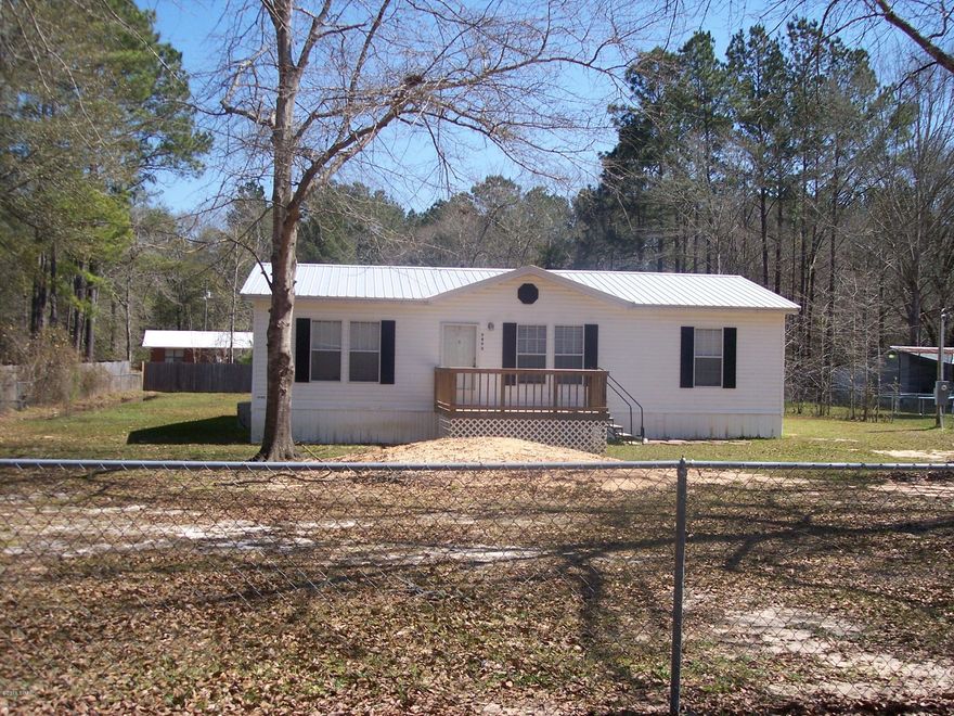 A well maintained 27x44 doublewide mobile home in Vernon on almost 1/2 acre.  A 14X14 room is added on the back which can be a bedroom, den, office, or studio as it is carpeted, closet, window, exterior door with window panes. There is a chain link fence around the yard with some privacy fence in back. This is a 2007 Destiny mobile home with 1384 square ft. Yard building in back yard.