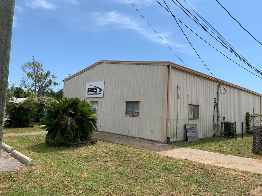 Great location with a well layed out building in the heart of PCB. Building is set up with small reception area and office bathroom, private office and a file and work space plus easy access to warehouse. Where you have (2) side by side 12' x 14' roll up doors 16' clear and with 18' ceiling height and covered loading area.