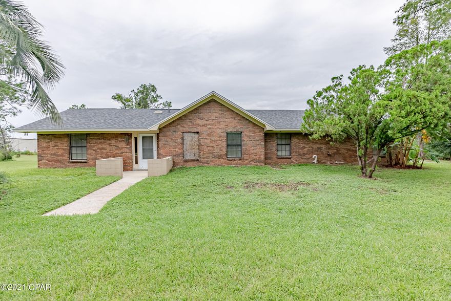 'CURRENTLY UNDER CONTRACT, SELLER ACCEPTING BACKUP OFFERS' Rare opportunity to own a home with more than an acre of land in the heart of Panama City Beach.  This all brick home boasts over 2,300 sqft and provides ample living space. With 3 bedrooms, 3 bathrooms and sprawling entertaining spaces this home provides plenty of comfortable space for family and friends. This home is located within a short distance to Great Schools, Shopping, Dining, the Navy Base, Marinas and the beautiful white sandy Beaches. highlights include a spacious back patio, perfect for cookouts, a storage building, fireplace, vaulted ceilings in the great room and tile floors throughout the main living areas. The eat-in kitchen with a Bay window provides plenty of counter space as well as cabinet space. The bedrooms also provide plenty of space for sleep and study, they also have updated flooring in two of the additional bedrooms. This home is a must see. Schedule your showing today and reward yourself with this great property.