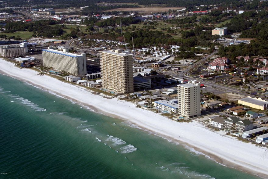 Welcome to Gulf Crest Condos, centrally located just off Thomas Dr. at the intersection of Joan Ave.  This one owner condo is a beautiful fully furnished 2-Bedroom 2-Bath ''Rental Ready'' unit just waiting for a new owner.  The unit is tastefully decorated and accented with all new furniture,(leather sectional) beds, and TV's, all a year old.  All the appliances including the washer & dryer are 3-yeers old.  The A/C unit was replaced 4-5 years ago.  The owner chose not to have a bunk area but there is plenty of room to add it back in, in the oversized dining area. THIS 7-TH FLOOR UNIT IS ON AN OPTIMAL FLOOR LOCATION TO ACHIEVE MAXIMUM RENTAL RETURNS.  THE OWNER DID OVER $36,000 IN RENTAL INCOME IN 2017, LOCATION, LOCATION.  The master bedroom suite features an oversized bathroom with a walk-in closet, laundry room, and owns closet.  Step outside your bedroom to the oversized 40-foot balcony.  The kitchen features a Whirlpool appliance package, plenty of counter and cabinet space, and a pantry. A wide foyer allows you plenty of room to move furniture and luggage through the front door.  Gulf Crest offers its owners and guests a secure gated complex with plenty of covered parking in a multi level parking garage.  This unit comes with very premium located parking spaces.  The amenities include two pools, one which is headed during the off season, three whirlpools, a tiki bar for summer drinks and snacks, a covered gulf front picnic gazebo and two beach access gates down to the sugary white sandy beaches and gulf.  Other amenities include a ocean side fitness room, game room, and meeting space.  Gulf Crest, besides being one of the area's most popular complexes,  it has an excellent location.  It is in walking distance to convenience stores, fast food places, numerous  restaurants, entertainment complexes for young and old alike, etc. Relax on your huge balcony and watch the dolphins and schools of fish swim by, or sit and enjoy those beautiful tropical sunsets and ocean breezes.   Come make Gulf Crest your new Panama City Beach destination.