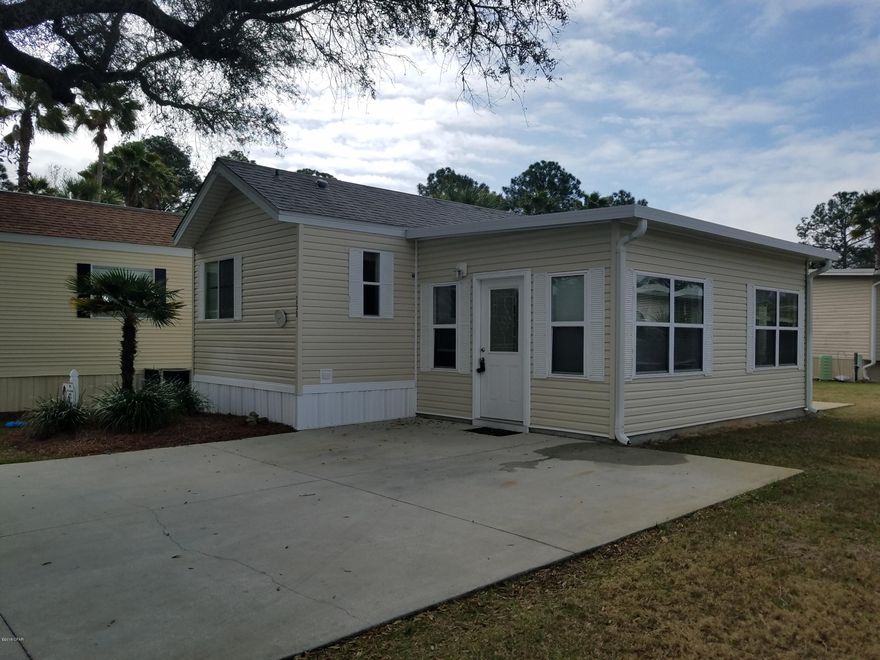 Centrally located in gated community, Emerald Pointe Resort, this 2 BR/2 BA unit is a great investment or retirement opportunity. New HVAC & Water Heater! Living room addition with closet, and sliding glass door to patio. Extra lot space for additions could be made. Master bedroom has vaulted ceiling and built-in closet/drawers, includes matching dresser (removable). Master bath has tub/shower combo; Guest bedroom has built-in Full size bed and build in closet/drawers; En suite bathroom with stand-up shower. Kitchen offers full size electric range, vented microwave, refrigerator. Washer/Dryer inside unit! Community amenities include 2 pools (1 heated) and hot tub, exercise room, lake for fishing, playground, clubhouse with entertainment. This unit has been well-kept and maintained