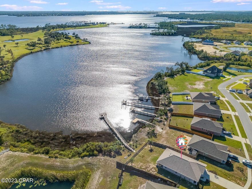 Currently under contract, seller accepting back up offers. WATERFRONT with the most spectacular sunset views over the open Bayou! This 2019-built all-brick home features a single level, waterfront primary suite and the luxury of your own PRIVATE DOCK. Offering nearly 2,000 SF with 3 bedrooms, a home office/bonus room, 2 full baths and a 2-car garage situated that on a large .4 acre homesite, this home has it all. 

This spacious home has an oversized waterfront living room that is open to the screened back porch where you'll enjoy coffee in the morning and host cookouts all year long. The back yard is large enough for a pool and is fully fenced. Step outside the fence to your own PRIVATE DOCK where you'll enjoy fishing for the many schools of redfish, watching dolphins jump and taking in the best sunsets the Bayou has to offer. The boat dock has the ability to add a boat lift easily and is deep water with TRUE GULF ACCESS. Enjoy trips to catch grouper in the morning and end up at Shell Island in the afternoon. Get ready to bring your catch HOME and live your best waterfront life by entertaining all your friends and family. 

The primary suite provides a luxurious retreat with waterfront views and is separate from the additional bedrooms. The en suite provides double vanities, a tub and shower. The oversized master closet is adjacent to the master bath and offers plenty of room for customization! The open plan features a dining room between the living room and kitchen, designed for entertaining at large gatherings. The kitchen has an island and with ample cabinetry and granite countertops, it's sure to be the best place to host your family to enjoy year-round. Near the foyer, you'll find a large home office that can also function as a bonus room/play room. Completely flooded with natural light from the front porch and opaque French doors, this is the perfect place to work from home or additional sleeping room for hosting guests. 

This is a 2019-built, single level waterfront home and has a brand new roof (June 2023), 2019 HVAC and hot water heater, built-in smart home system and vinyl flooring. Hodges Bayou Plantation is a new community and features lovely sidewalks and waterfront views! 

Enjoy your best life living waterfront with your family in this home that is move-in ready at only $515,000! This home is also eligible for USDA loans which allows up to 100% financing, based on eligibility!