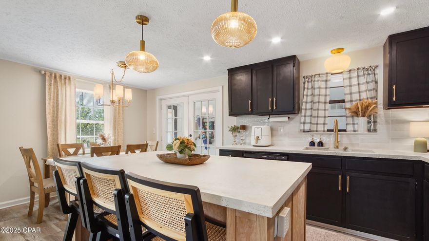 OPEN HOUSE, FRIDAY (2/27) 11:00am - 1:00 pm and SATURDAY (2/28) 10:00am - 12:30pm.  Welcome to this beautifully refreshed 3-bedroom, 2-bath home that perfectly balances modern updates with everyday comfort. Ideally located just minutes from Tyndall Air Force Base, shopping, dining, Walmart, Aldi, and an array of restaurants, this move-in-ready gem is a rare find in this price range.
Step inside to a light-filled open floor plan, where the cozy fireplace sets the tone for warmth and charm. The living areas feature newer luxury vinyl plank flooring throughout, while the freshly painted exterior adds to the home's inviting curb appeal.
The kitchen is a true highlight, recently updated with cement countertops, a crisp white backsplash, a splash of color on the cabinetry, and a newly added island complete with a built-in wine cooler--an entertainer's dream. Stainless steel appliances and a seamless flow into the dining area make this space as functional as it is stylish.
In the last few years both bathrooms have been thoughtfully updated, including new toilets and a refreshed master shower, adding to the home's move-in-ready appeal.
Step outside to enjoy the oversized, fully fenced backyard, complete with a brand-new cement patio--perfect for gatherings or quiet evenings. A powered shed offers space for storage or hobbies  provides even more convenience. With a roof replaced in 2018, you'll enjoy peace of mind for years to come.
Whether you're a first-time homebuyer, a busy professional, or someone downsizing or transitioning into retirement, this home offers the perfect blend of charm, function, and modern upgrades. Don't miss your chance to own a home that delivers more than expected!