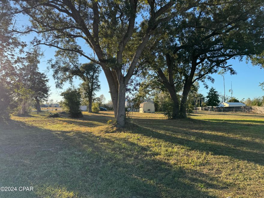 This gorgeous half acre corner lot is located in the beautiful Deerpoint Lake area and just minutes from a boat launch and swimming area.  The lot is cleared but there are several lovely large oaks on the property positioned nicely so that you can easily build your home without removing these trees.  There is a 16x8 storage building in very good condition that does convey with the property.  There is also a septic tank and well on the property that was in working condition in February, 2022 when someone last lived there.  There is power to the property and it is in a flood zone X that makes it even better so what are you waiting for? Zoning is County R-1.  Come check out this nice lot and get ready for your new dream home!