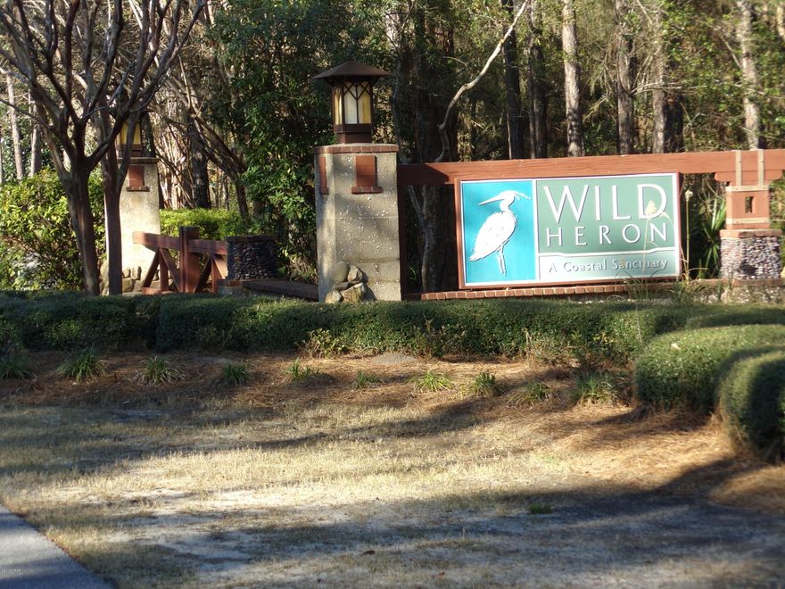 Wild Heron is one of Bay County's most exclusive subdivisions.  This is for nature lovers as this community lies along the shores of Lake Powell, which is the largest dune lake in Florida.  The brackish inlet holds both fresh and saltwater fish and empties into the Gulf of Mexico.  This is one of the larger lots in the subdivision measuring at almost an acre, (.89-acres).  This high and dry building lot has lots of native trees on it and backs up to conservation areas in the back of the subdivision.  Large custom built homes are the norm here with architecture styles consistent with nature and its beauty.  This lot sits at the end of a cul-de-sac so there should never be an issue with traffic.  The community has lots to offer its residents, miles of walking paths, a tennis center with multiple courts, a waterfront clubhouse, HOA office, childrens park, community pool and deck area, along with fishing docks in the lagoon/lake, a community boathouse where residents have access to canoes and kayaks, a fitness center, etc..  Nice tree lines streets wind through this beautiful community.  There is also an award winning Greg Norman golf course.  Sharkstooth Golf Club is known throughout the SE as one of the prettiest and challenging courses  to be found.  If you are interested in living in a beautiful gated community 1-mile from the beautiful beaches of the Gulf of Mexico and want an oversized lot then this property is for you.  For building restrictions go to mywildheron.com