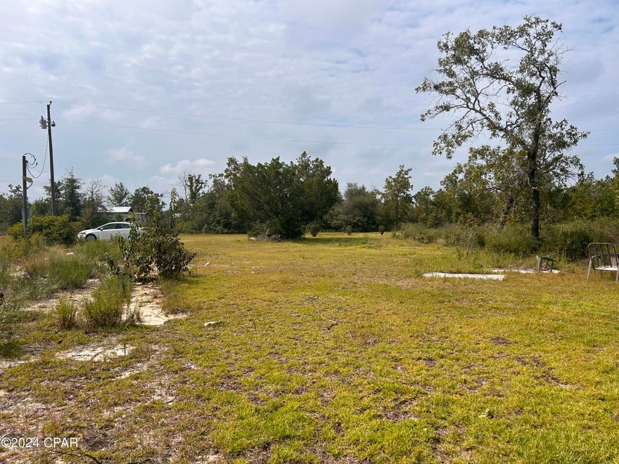 Affordable 1.28-acre lot in peaceful Marianna, FL, just outside Bay County. This property has an original septic tank (1986), working properly eight months ago, a power pole that needs a new electric box, a well that needs a pump, and some clean up. Recently cleared of a mobile home, this land offers a prime location just an hour from Panama City Beach. Priced well below market value at $15,000 for a quick cash sale—don't miss this opportunity to own a piece of tranquil Florida living.