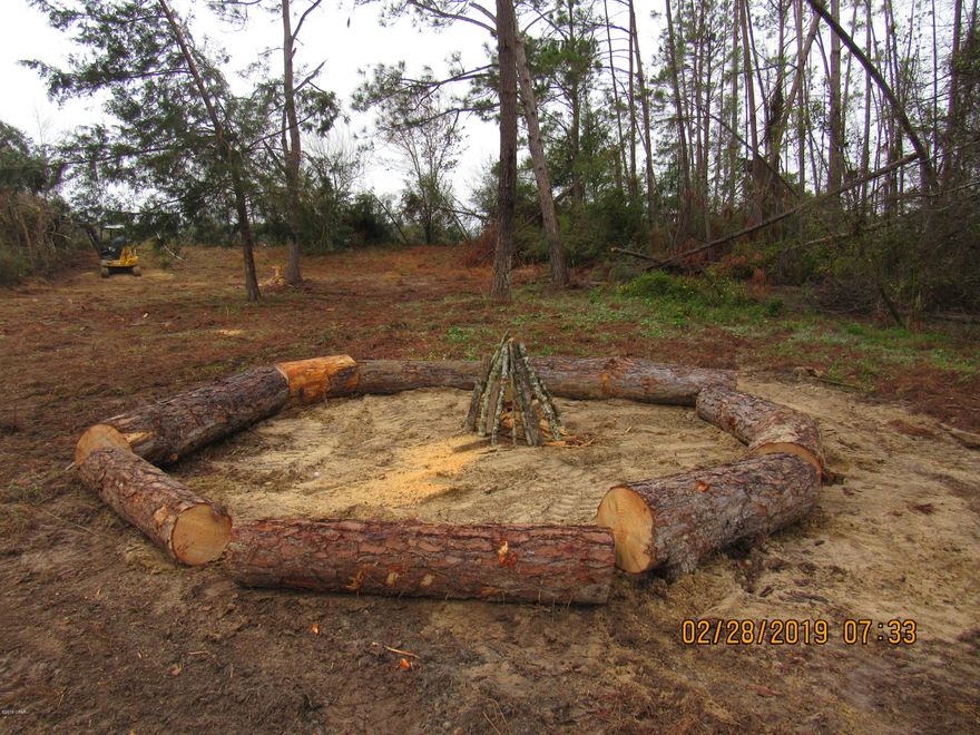 READY to build on or move a Mobile home on to, waterfront  parcel  in the Compass Lake area.  This property has been cleared of hurricane debris and the mobile home has been removed. ELECTRIC, WELL and SEPTIC all in place ready for the new home. Homesite has been cleared and the boundaries of the entire property have been left alone for privacy. The many surrounding lakes have some of the BEST fishing in Northwest Florida. Deer, Fox, Wild Turkeys all come to visit each day along with Eagles and Hawks. Sit around the campfire and share your adventures with each other. This Homesite is only minutes away from The Worlds Most Beautiful Beaches, Marianna Caverns, Econfina Springs, Tyndall Air Force Base, Famous Pier Park Shopping and several State Parks. New Survey is available. Call Today !!!