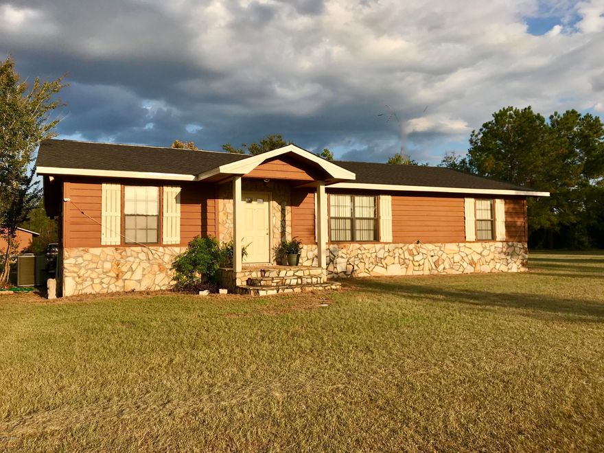 17.56 ACRES, FENCED AND CROSS FENCED, PASTURE, 3br/2b, 2331 H/C SQ FT, SPLIT BEDROOM PLAN AND BARN. Come enjoy country living. Sit on the back deck and enjoy the quiet, watch the wildlife, enjoy the privacy. The home has formal sitting room and formal dining room, The family room has built in entertainment unit, the kitchen is set up for the chef and has a breakfast bar and pass through window. The master suite is spacious and has a walk in shower and whirlpool tub. The home has a new roof, new H/C UNIT, new interior and exterior paint, a 16 x 35 back deck and a 36 x 50 barn with concrete center. Ready for livestock, Children and family. BLUE SPRINGS RECREATION PARK and the beautiful Merrits Mill Pond is within 2 miles for swimming and boating. Please see the aerial with photos