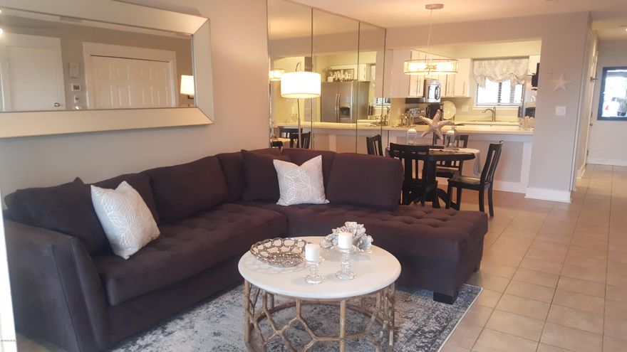 This nicely updated condo is a short walk to the beach! Updates include 2nd floor  vinyl Plank flooring, new tub/shower combo with nice modern tile. open oak stairwell with ship lap encasing the staircase, Custom Barn Door on the half-bath entrance. Stainless/Black appliances in the kitchen, built-in ET center in the family room, new ceiling fans and lighting throughout the entire home, along with new 6 & 8 inch base boards throughout, new Bathroom vanities and sinks with granite tops. This End unit common ground is large for all your BBQ and yard games and is a pet friendly resort with three pools (1)heated off season) two tennis courts, a large clubhouse, fitness center and shuffleboard.  Lots of planned activities in this wonderful Resort.  Golf carts welcome!