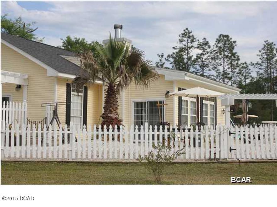 JUST REDUCED!! Beautiful Cottage home, You must see this one. This home has a beautiful country setting, yet not to far from the beaches. Inside this home looks like a magazine and has been very well cared for. This home has 10ft ceilings, crown molding, archways and  planters walls. The kitchen is open to the living room and dining area, and boasts a large island. There's also a office space off the living area. This beautiful cottage has engineered hardwood floors. The laundry room has a craft area with a counter area and glass blocks and is located off from the kitchen. Outside the French Doors from the master bedroom is your very own private pool. This cottage has a white picket fence around the pool, also there's a pergola at the front door. Large yard. This is a MUST see home