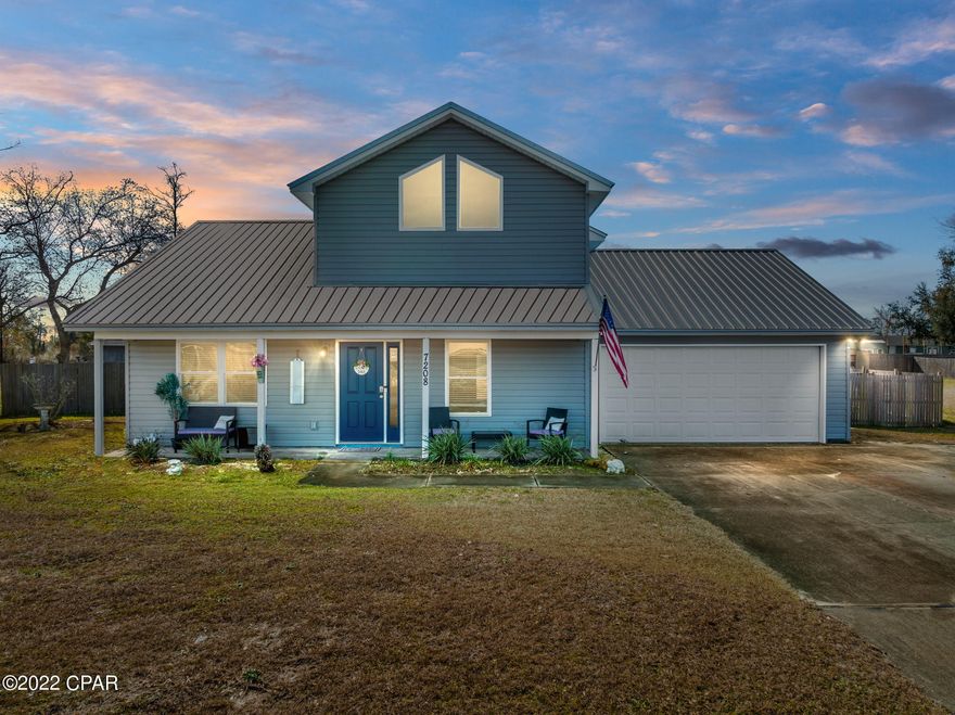Welcome Home to 7208 Ranier Street. This meticulously maintained Move-in Ready home sits on a private ½ Acre fenced lot. Enjoy the feel of country living, and just a quick drive to town and beach. When you enter, you'll immediately feel the square footage feels much larger with the tall living room cathedral ceilings. The flooring is Luxury Vinyl plank, in the main living areas & baths with two carpeted bedrooms downstairs. Enjoy your private Master Suite secluded by itself on the second floor, with custom barn door and subway tile in the bathroom, and large walk-in closet. The kitchen features custom hardwood cabinetry, subway tile backsplash, granite countertops, oversized pantry & all stainless-steel appliances. Upgraded lighting throughout. Easy maintenance free Vinyl siding on the exterior, New Metal Roof, Windows and HVAC in 2019, Water Tank in 2021, quiet neighborhood and no HOA here. Survey is available. Call your agent today and schedule a Tour!