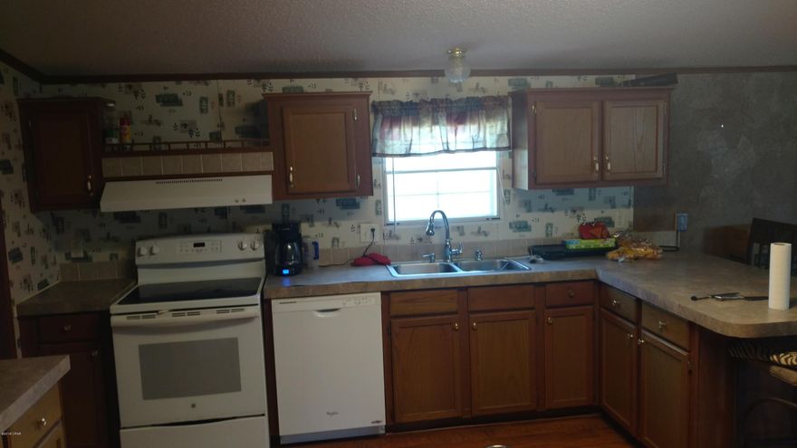 A very nice home that is move in ready on a half acre with Pinecrest Dr being county maintained. This three bed two bath home is spacious with a wood burning fireplace. Very large rooms will give you living space with out crowding.  There is a storage shed included in the sale . All personal items and the washer and dryer are excluded in the  sale. The owner has a guard dog in the house. A twenty four hour notice to show is needed. Pre-qualified buyers only. Additional pictures will be loaded soon.