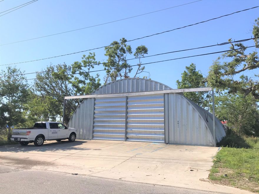 This is a 5,000 square foot quonset hut building on a 1/3 acre parcel at the northwest corner of East Avenue and East 6th Street (one block north of E. Business Hwy. 98). This unique corrugated arch structure is well known for its strength and usable space. The open clear span design makes it perfect for many uses such as; workshop, bulk storage, etc. There is minor damage to the metal on the north end of the building.