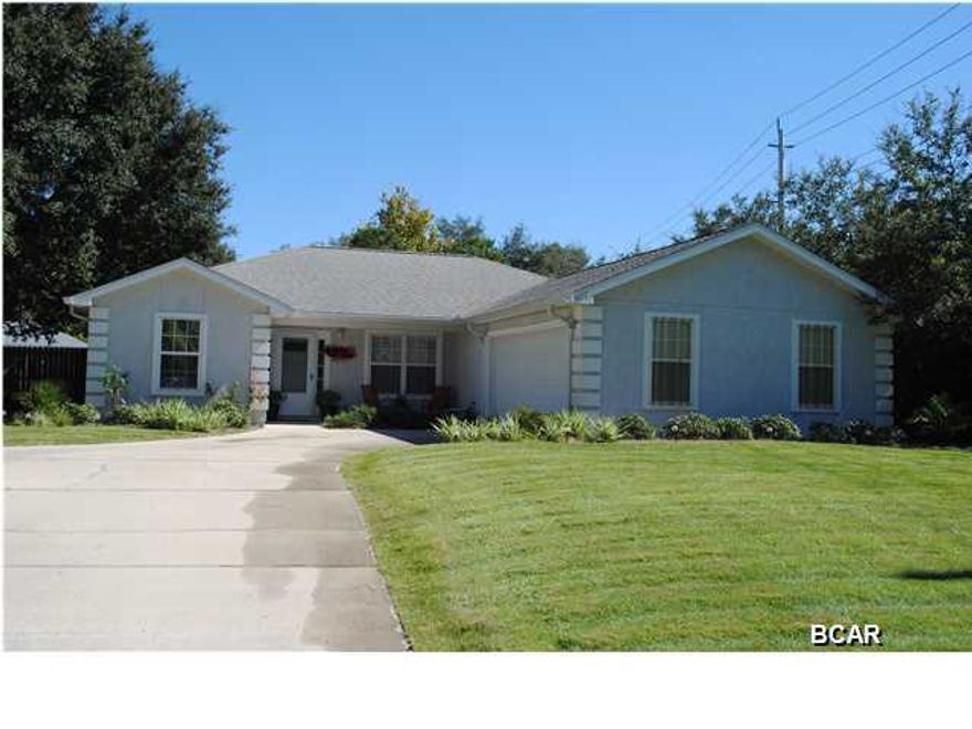 Very nice well kept home conveniently right off of North Lagoon. This 3 bedroom 2 bath home shows pride of ownership throughout. Very Clean and ready to move in, the split floor plan has well thought out details such as bull nose corners, tile back splash in the kitchen, tray ceilings in all bedrooms and up-light tray ceiling in living room. Living room is also wired for surround sound. Bathrooms, kitchen and dining room are tiled in neutral colors and master bedroom is both spacious and complete with a large walk in closet. Located on an over-sized fenced lot with room for outside storage! When touring this home you will notice french doors leading out to a screened in patio. Outside area is perfect for entertaining and is a must see! This home also features and oversized two car  garage. Call today to view this wonderful home!