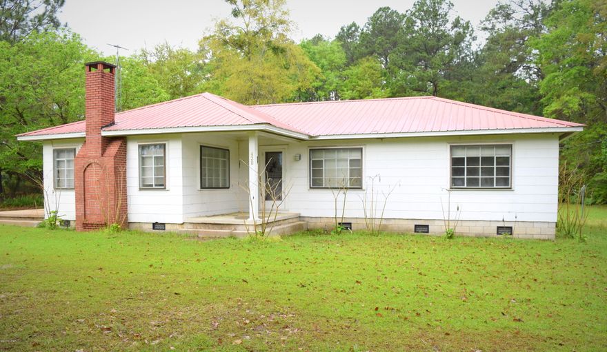 Sitting on a 5 acre lot within the city limits, this 3/1 country style home features a spacious living room with fireplace, built-in shelving, massive laundry room, stained crown molding throughout, updated HVAC and an abundance of storage throughout. Outside you will find a 25x50 workshop equipped with pull through roll up doors, insulation, shelving, multiple outlets and shop lights. Property is located just north of town just off Hwy 77.