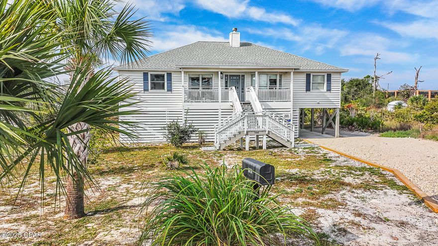 BAYSIDE SUNRISE RETREAT!! A beautifully updated 3 bedroom/2 bath coastal beach home tucked in the quieter North end of Cape San Blas. Situated in an X flood zone on a peaceful cul-de-sac, this bayside gem delivers captivating sunrise views from the covered deck & offers quick access to both St Joseph Bay & the sugar white sand beaches-making waterfront adventures part of everyday life. Recent renovations shine throughout, including a fully updated kitchen, modern baths & new appliances, creating a fresh, inviting interior. The single-level layout offers exceptional comfort, with light-filled living & dining areas that maintain open sight lines while still creating cozy, defined spaces. A central fireplace serves as a beautiful architectural focal point  that adds warmth & charm to the heart of the home. Thoughtfully designed, the floorplan places the kitchen, sitting area, dining nook & primary suite on one side, while a second living room, dining area & two guest bedrooms anchor the other—ideal for hosting family, friends or multi-generational stays. Outdoor living is just as appealing with a screened back porch, covered front deck, shaded lounge space beneath the home & an enclosed outdoor shower perfect after a day on the water. Three spacious ground-level storage rooms provide ample room for beach gear, kayaks, fishing equipment & all the essentials of coastal living. With FEMA flood insurance available, covenants in place but no HOA, and St. Joseph Peninsula State Park just two miles away for boating, biking & exploring untouched shoreline, this location offers both peace of mind & unforgettable natural beauty. A rare bayside retreat in one of the Cape's most serene settings—come see why life is better on the Cape. And when you're ready for dining, shopping or small-town charm, the adorable town of Port St. Joe is just a short, easy drive away. Call for your private tour & LIVE THE BEACH LIFE!