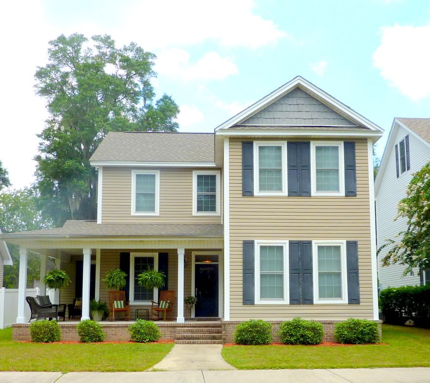 Lovely 4 bedroom 2.5 bath home under the beautiful oaks in the community of Riverside.  If you are looking for a home with charm and a great floor plan, this well kept home is a must see.  Complete with Southern style wrap around front porch and views across the landscaped front lawn community, there are so many great features. Granite and stainless island kitchen with maple cabinets, comfortable breakfast/informal dining, plus formal dining room, hardwood floors through out and adorable touches in design such as window seats, you have found your new home.  Designed with a spacious first floor master bedroom, master bath with double sink vanity and large walk in closet, and jetted tub/separate shower features.  Second floor boasts three large bedrooms and a huge bonus/media room. The community of Riverside is tucked away under mature trees, side walks leading to the community club house, work out room, and pool and playground areas.  Additionally, Riverside is just that, with pathways going down to the river for fishing and water fun. Conveniently located near the new North Bay Haven Charter School, this home is ready for you!   Make your appointment to see this lovely  home today.  24 hour advance notice appreciated. Room measures are approximate. If important, please verify.