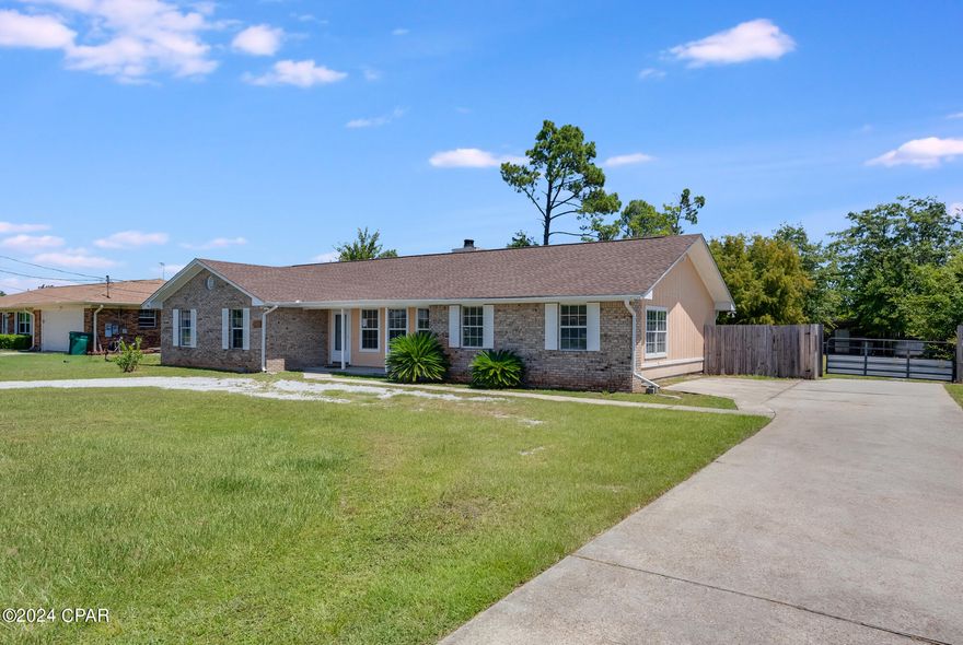 Welcome to this charming four-bedroom, three full bath home, nestled on a spacious 1/2 acre lot. Built in 1990, this home offers a thoughtful layout and has been freshly updated with a newly painted interior. Enjoy easy maintenance with tile and LVP flooring throughout—no carpet in sight! Step outside to a large, screened-in porch, perfect for relaxing and overlooking the expansive backyard, complete with a large garden shed for extra storage. 

With no HOA, you have the freedom to truly make this property your own. Ideally located, you'll be close to Tyndall Air Force Base, shopping on the East side of town, and some beautiful parks along the Bay. 

*Age, square footage, lot size, and all dimensions are approximate and should be verified by the buyer.