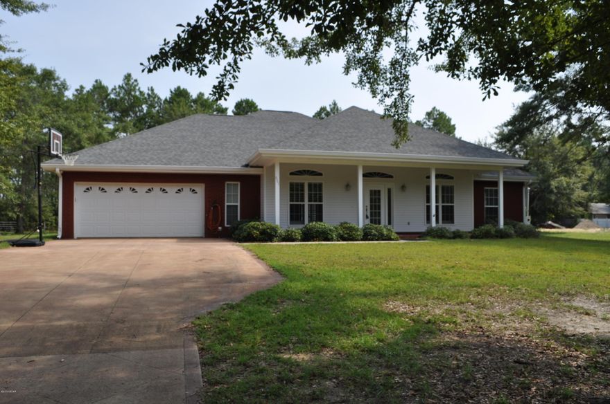 Custom built home on 2.4 acres in the Southport area.  Very quiet and beautiful property with a 3BR/2BA home and lots of space to build more.  The home was built in 2009 and no expense was spared.  The home features a split-bedroom floor plan, tall ceilings with recessed lighting, French doors, and stained and scored concrete floors throughout.  Graceful columns add a touch of elegance without closing off the formal living and dining rooms from the great room where there is a built-in entertainment center with gas log fireplace.  The kitchen boasts rich cherry cabinets, stainless steel appliances and granite counter tops.  There's plenty of room to prepare a feast and there is a walk-in pantry to help keep all your food stuffs and small appliances organized.  The Master Suite has a tray ceiling, walk-in closet and an en suite with whirlpool tub and separate shower.  The other two bedrooms share a Jack-n-Jill bath with separate pedestal sinks and a private water closet.  The attached/oversized two car garage has pull-down stairs to the attic and behind the home, there is a detached two car garage/workshop and another workshop with carport.  At one time, the sellers had a mobile home on the additional portion of the property.  While that has been removed, you can see there is more than enough room to bring in another mobile home or build another home!  In addition, the land across the street is county owned and therefore, will not be built on.  If you're looking for a large and comfortable home with extra land and lots of privacy, then this is it!  You're only 5-10 minutes from schools, shopping and more.  All info is approx. and must be verified by Buyers if important.