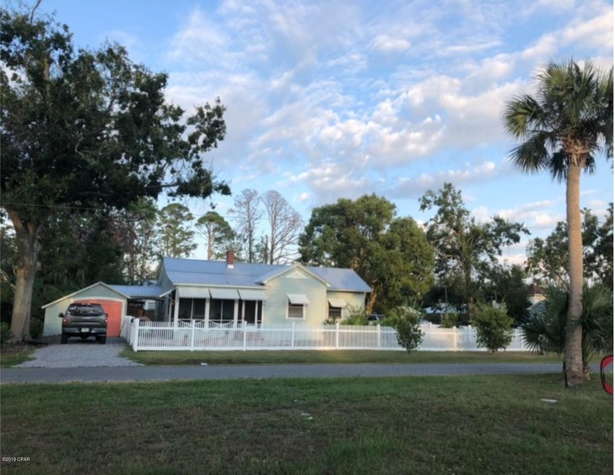 Beautiful coastal cottage near the Bay in Port St. Joe and also very conveniently located to downtown. This home received minor damage from Hurricane Michael and was purchased and renovated beautifully by the current owners. The kitchen is gorgeous with custom cabinets, quartz counter tops, stainless appliances, and gorgeous original pine floors. A full bath was added off of a 2nd living area and now functions as a bedroom suite/3rd bedroom with private bathroom. Great outdoor space with a new fire pit/brick paver area inside a newly fenced yard. Covered parking, storage shed, and many more extras with this charming, move in ready home.