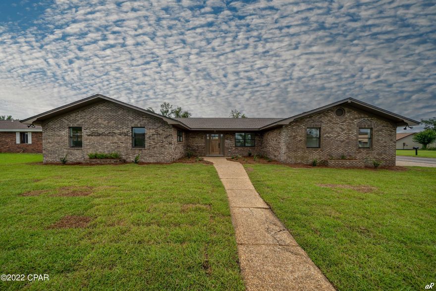 Located on a desirable corner lot with an expansive yard, this charming 5 bedroom 2 bath brick ranch Home has a lot to offer!  Plenty of room for a pool and tucked into the tranquil neighborhood of Derby Woods where utilities are underground offering a clean landscape. The clean, open floor plan with white minimalist interior is a breath of fresh air.  Master ensuite bathroom features a modern glass doored shower and fresh tile. Recent upgrades include pendant, fan and recessed lighting, quartz  countertops and island, new kitchen cabinets and pantry, matching dark patina hardware, Luxury Vinyl Plank throughout, interior sliding barn door, stainless steel appliances, and freshly painted brick fireplace with gas insert. New storm grade windows and exterior doors throughout. Board and Batten, hardiplank on the rear of the house. Spacious 2 car garage and ample storage in each bedroom. Within 10 minutes to Anderson Bayou and local boat launches, Nature Walk and Panama Country Club Golf Course. Buyer shall verify measurements and details.