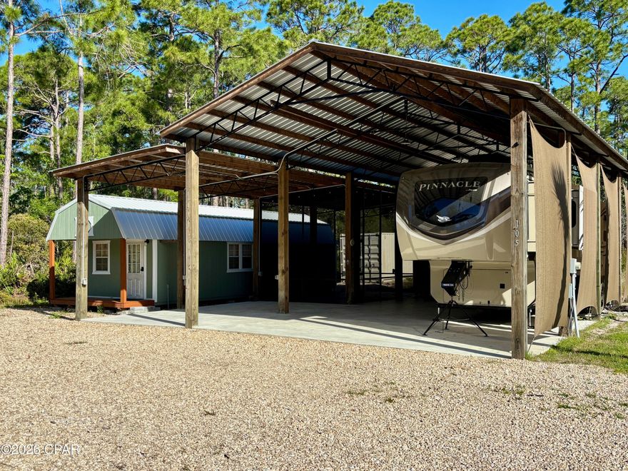Looking for the ultimate home base between the bays and the Gulf? This unique property offers the perfect blend of country seclusion and coastal convenience. Whether you're looking for a weekend getaway or a permanent site to park your rig, this lot is fully equipped and ready for adventure. Ready Pole Barn: Includes a spacious screened-in porch for bug-free evenings and an outdoor shower to rinse off the salt and sand. Convenience On-Site: Equipped with a sturdy metal storage building for all your gear. An additional outbuilding on the property is perfect for a workshop or a cozy small loft apartment. Bonus: 2020 Jayco Pinnacle 36SSWS Camper to be sold with the property at an additional price of $35,000! Just minutes from the Indian Pass boat launch, making it a breeze to get on the water. Experience the quiet peace of the country while staying connected to everything the Forgotten Coast has to offer. Don't miss your chance to own a slice of paradise in one of the most sought-after areas of the panhandle!