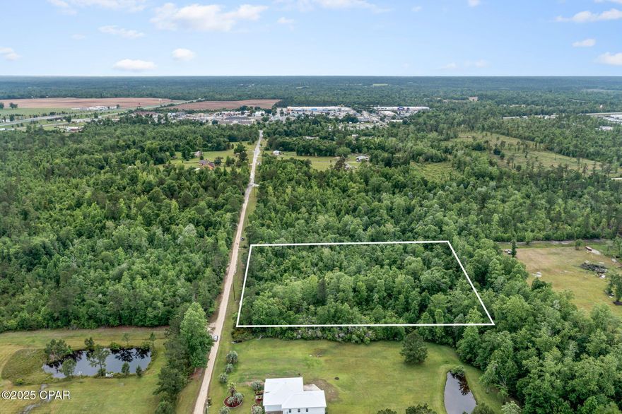 Discover the perfect blend of country living and city convenience with this 2.95± acre wooded tract! Tucked away in a peaceful setting, this property offers privacy and natural beauty, with the flexibility to clear as much—or as little—as you like. While a well and septic system will be needed, electricity is readily available. Ideally located just minutes from I-10, Walmart, Lowe's, restaurants, and more—enjoy the tranquility of rural life without sacrificing access to everyday essentials. Don't miss this versatile property in a prime location!