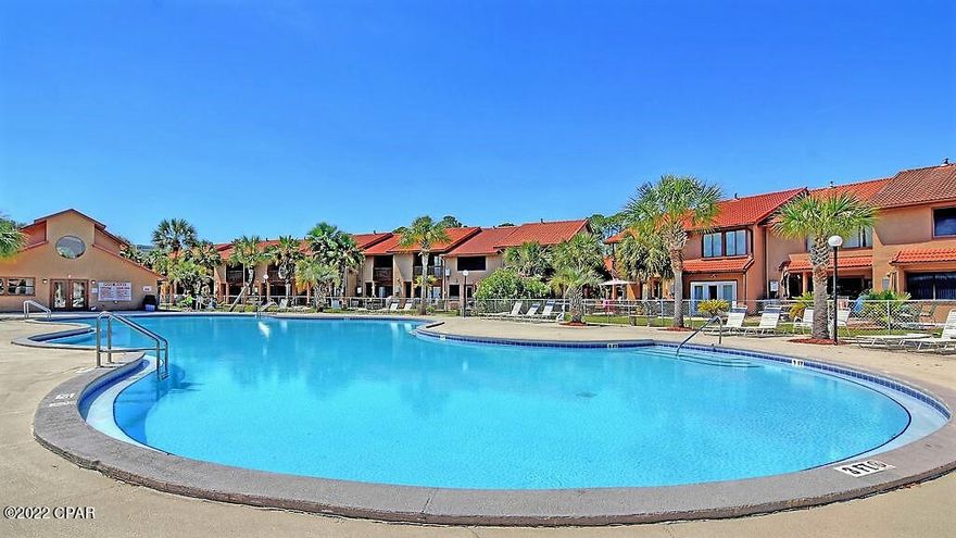 Located on the ''Island'' in Gulf Highlands - 5 min. walk to the beach. Townhouse backs up to and overlooks the main pool. It's a charming and updated 2BR, 2.5BA with 2 dedicated parking (no parking hassles or elevators). 11 Pools, tennis, shuffle board, and basketball courts, putt putt golf, and a gym.