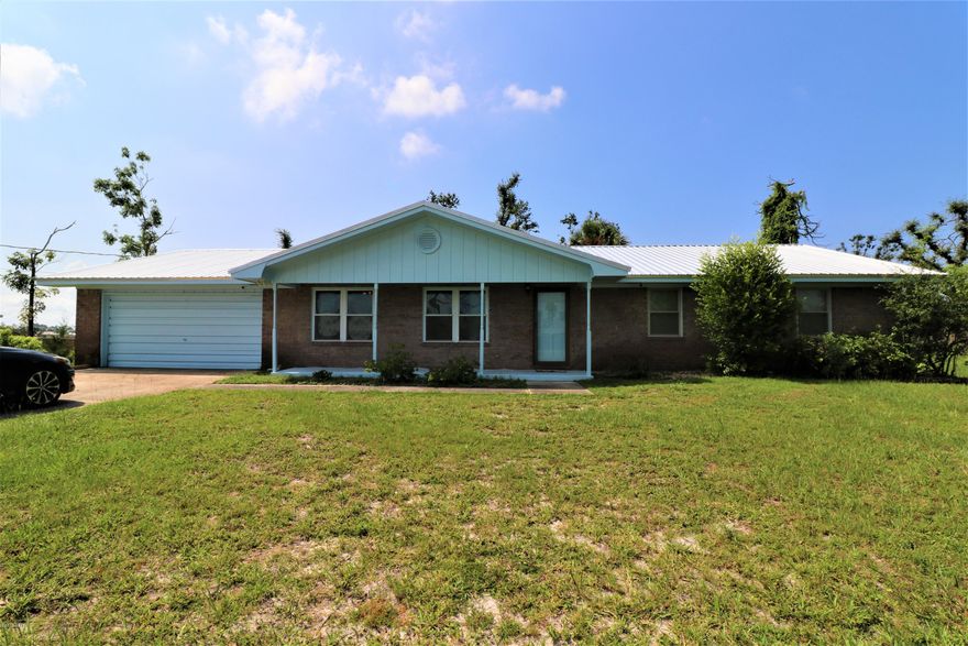 CURRENTLY UNDER CONTRACT, SELLER WILL CONTINUE TO SHOW AND TAKE BACKUP OFFERS.  Need Space inside and out? Check out this Affordable All Brick 4 bed 2 bath home with Pool on just over Half Acre lot!!!  This home is located close to Tyndall AFB, shopping, entertainment, and let's not forget the Beaches of the Beautiful Gulf Coast, Panama City Beach, Mexico Beach, Fishing in Bay and Gulf Counties all here for your pleasure.  This home features a new Metal Roof, new/newer windows, new pool pump 11/18, pool liner 5/19, paint outside 3/19. Home has lots of space large formal dining room, living room, Kitchen and Dining areas and Large Laundry room that could be used as an office, craft room or Huge Pantry! Home also includes a Cobra Home Monitoring System with 4 cameras hardwired-self contained. All info should be verified if important. Thank you for considering this home!