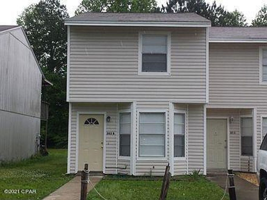 This townhome went through a complete renovation in 2015 with all new appliances, carpets, counters, plumbing and paint. New roof and siding after Hurricane Michael.  All tile floors downstairs with 1/2 bath downstairs, and 2 large bedrooms up. The master bedroom has a slider that opens up to a balcony that overlooks a  spacious fenced yard. The lot is 200' deep so there is room for a garden in back as well.