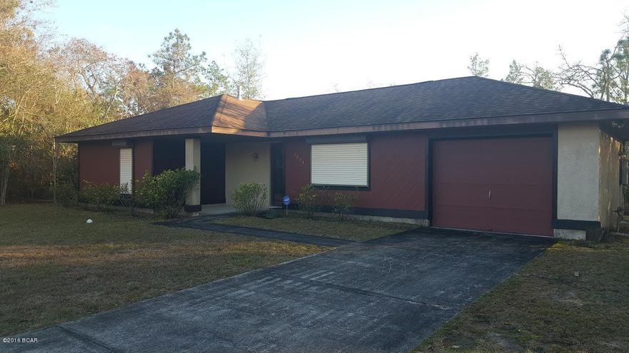 Nice 2/2 home on 2 lots in Sunny Hills. Home has kitchen/dining area, gas stove, dishwasher, refrigerator, garbage disposal.Living room, family room. Master bedroom has sliding glass doors out to concrete patio, master bath with shower. Gas hot water heater. Washer and Dryer included. Roll down storm protectors on windows, single car attached garage with laundry area. Outbuilding. Security system. Lot home sits on is landscaped, extra lot beside home is wooded.