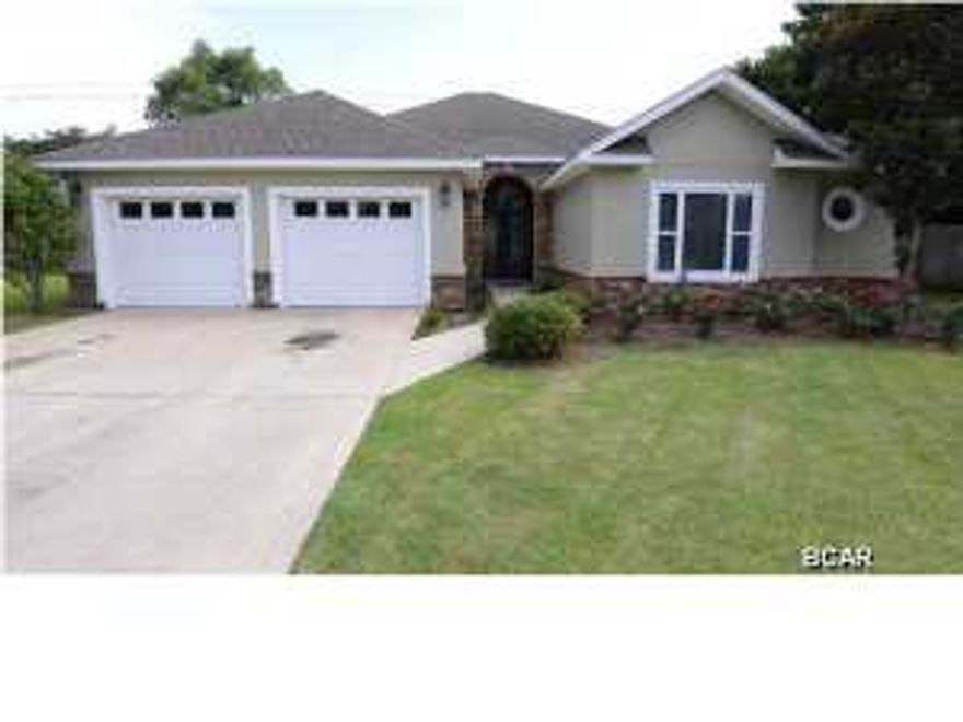 Gorgeous Pelican Bay home on a cul-de-sac. This single story 3 bedroom 2.5 bath home features a split-bedroom floor plan with Jack and Jill bedrooms. There are many outstanding architectural details throughout the home including arched doorways and 12' ceilings with crown molding, There is an interior stacked stone fireplace from ground to ceiling as well as a custom built large outdoor fireplace to compliment the beautiful pool. A brand new irrigation system was recently installed as well. It has brand new carpet in all the bedrooms and new wood flooring in the living and dining rooms. This is an all-electric home with never been used stainless steel appliances to include a built in beverage/wine cooler and an abundance of cabinet space. Pelican Bay is a quiet,