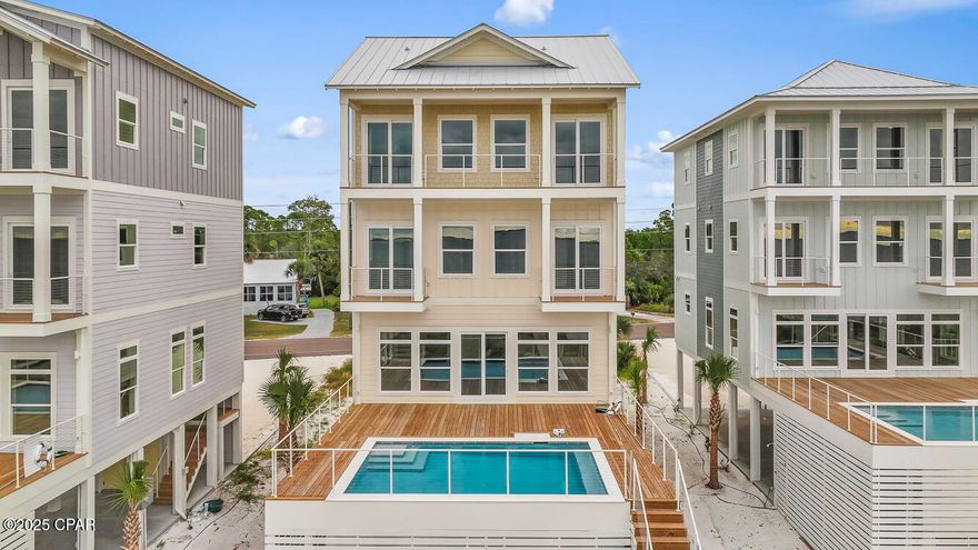 ULTIMATE GULF FRONT HOME! Nestled on pristine Gulf front sand, 273 Watermark Way offers the ultimate coastal escape-where turquoise waves, sugar-white beaches & unforgettable sunsets set the stage for lifetime memories. This brand-new custom beachfront build, within the serene lower-density stretch of St. Joe Beach, effortlessly combines luxury, comfort & coastal charm. With six beautifully appointed suites, this home is perfect for multi-family vacations or large groups seeking space, style & shared experiences. Each beachfront king suite opens onto its own deck, allowing you to drift awake to sea breezes and Gulf views. The homes best feature is a private heated pool just steps out the door to be enjoyed year round. The soaring open living spaces, gourmet kitchen & soft coastal finishes evoke easy elegance. The layout is designed for joyful mingling where you enjoy panoramic Gulf vistas from every level & wide decks that connect you to the horizon. An elevator provides smooth access across all floors. Beyond the walls of this spectacular home, you'll find immediate access to the Gulf with a private boardwalk & steps to powdery sand. Hop in your golf cart or go for a peaceful bike ride along the paved paths to Windmark Beach where you will find fun, food, and entertainment for the whole family.     A short ride into Port St Joe connects you with  boutique shopping, fresh seafood restaurants, a bustling marina, and a charming historic district. Whether you're planning an epic family retreat, a generational reunion, or a carefree getaway with friends, this home is built to host in style. From sunrise yoga to cocktail hour on the deck, to late-night stargazing by the sea—every moment unfolds with elegance and ease. Call for your private tour & LIVE THE BEACH LIFE!