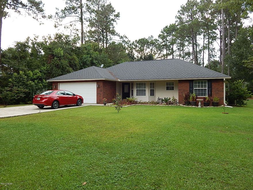 Beautiful newer open floor plan home sits on a country-like setting but located about 10 minutes to Panama City Mall and a short commute to Tyndall AFB. This split bedroom home is warm and inviting. The master is very nice with walk in closet. The 2 other additional bedrooms are spacious. High Ceilings in the living area make this home feel even larger. Kitchen has nice hardwood cabinetry and plenty of counter space and ceramic tile floors. The floors have all been upgrade with beautiful hardwoods. The garage has been partitioned off and AC added for a extra office or workshop. There is another approx +/- 200 Sf of finished space INCLUDED IN THE SFFIGURE with the front half is for storage. You could convert it back to a working garage. Show's beautifully and well maintained.