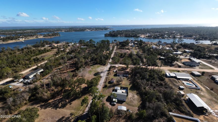 Endless possibilities await on this 0.458-acre lot in Southport! This well-maintained manufactured home sits on a quiet dead-end road with virtually no traffic, where homes are spaced comfortably apart, offering both privacy and peace. Zoned R2/R4, the property is incredibly versatile - live in it, rent it out, renovate, or start fresh and build your dream residence. Two well-kept storage sheds and a large yard provide ample space for outdoor projects, play areas, pet roaming, or equipment storage. Just under half a mile to Fanning Bayou and the Donald Penny public saltwater boat ramp, this location is perfect for boating, fishing, or waterfront adventures. Only 12 miles to downtown Panama City, you enjoy convenience without sacrificing tranquility. With new construction already underway throughout Southport, this is a rare opportunity to secure a property like this before the area fully develops. Imagine the lifestyle possibilities - space to roam, room for gatherings, outdoor hobbies, and a blank canvas ready for your vision, whether it's a family home, investment, or your future dream property.