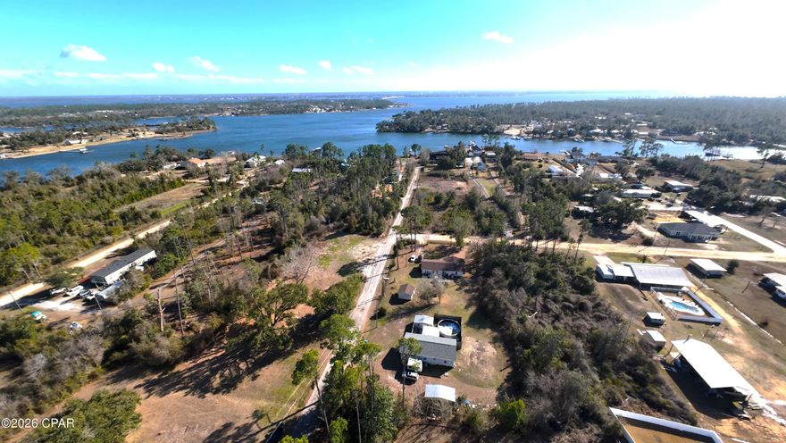 Endless possibilities await on this 0.458-acre lot in Southport! This well-maintained manufactured home sits on a quiet, dead-end road with minimal traffic, where homes are spaced comfortably apart, offering both privacy and peace. Zoned R-2, the property is incredibly versatile allowing for manufactured, single-family, or duplex housing - live in it, rent it out, renovate, remodel or start fresh and build your dream residence or multi-family investment. Two well-kept storage sheds and a very spacious all-around yard provide ample space for outdoor projects, play areas, pet roaming, equipment storage, etc. 
Just under half a mile to Fanning Bayou and the Donald Penny public saltwater boat ramp, this location is perfect for boating, fishing, or waterfront adventures. Only 12 miles to downtown Panama City, you enjoy convenience without sacrificing tranquility. You'll also enjoy a short 20 minute drive to the Northwest Florida Beaches International Airport, 30 minutes to Econfina Springs (local favorite), 35 minutes to Schooner's public beach access, and 27 minutes to the new TMH Urgent Care and full-service, 180 bed Hospital. 
Plus, as Southport expands and beachgoers flock to the coast, new construction is already underway. This is a rare chance to secure a property before the area fully develops. Tailor this purchase to your ideal lifestyle. It offers space to roam, room for large gatherings, and easy access to outdoor adventures like boating, fishing, kayaking, paddle boarding, and swimming. This is a canvas ready for your vision - move in now, rent as an investment, or build your dream home OR duplex!