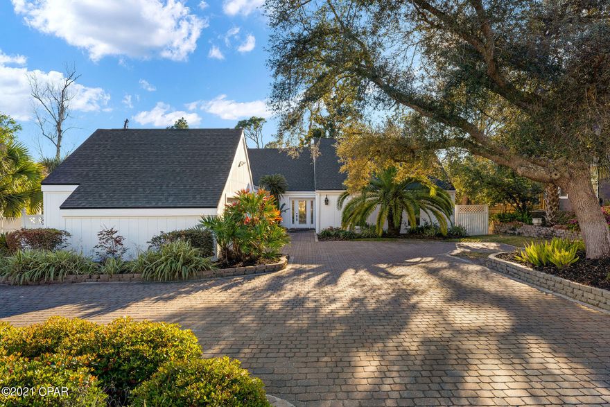 Under contract - seller taking back up offers! Gorgeous new updates await in this pristine custom built home in the securely gated golf course community of Bay Point.  The huge living room is 23x32 with extremely high vaulted ceilings! Step out the sliding doors to a unique back yard gated separately, perfect for dogs, and wrap around deck. The wet bar opens from the kitchen to the living room to make for the perfect entertainment space in an open concept, modern floor plan.  New roof, interior and exterior paint, front windows, skylights and driveway in a contemporary makeover make this stunning home the one you must see! New sod, two tankless gas hot water heaters & gas for range & whole house generator Pool table & furnishings negotiable. X flood zone for lower insurance rates. This home was featured in Southern Living since designed by Bozarth Associates architect's as a personal residence.