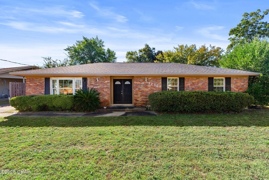 Well maintained brick home in a convenient, central Panama City location - close to schools, shopping, parks, Tyndall AFB, and the beach. Step inside to a spacious living area featuring luxury vinyl plank flooring throughout for style and easy care. The fully equipped kitchen offers ample cabinet space and a breakfast bar that opens to the dining area, creating a comfortable flow for everyday living or entertaining. The home features three bedrooms and two full bathrooms, including a master suite with its own en suite bath. Enjoy the outdoors year-round from the large covered back porch overlooking a fenced yard, perfect for pets or play. An HVAC system replacement will be completed prior to closing, providing added peace of mind for the new owner.