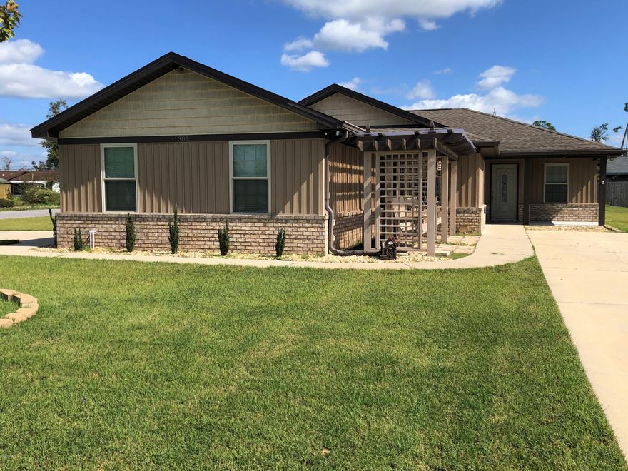 Don't miss this opportunity! Located in the heart of Lynn Haven  with bonus Man Cave!  The 4 bedroom,  2 bath home has a split bedroom floor plan along with many upgrades. Upgrades include crown molding, built in bookcases with room for a large television, beautiful wood  kitchen cabinets with solid surface counter tops, and a Night Owl Security System with 6-8 cameras installed throughout the home and property which can be monitored from a smart phone or tablet. There is a Culligan Water softener with reverse osmosis under the kitchen sink, which  has just been serviced. The HVAC is serviced twice a year and there is a current termite bond on the house and ''Man Cave'' which is transferable to the new owner.  At the front of the house, are two pergolas with swings for outdoor enjoyment and relaxing, along with a front porch. There is also a covered back porch and patio as you exit out the back door. The corner lot has a side entrance two car garage. The garage has been insulated and has cabinets for tools and storage. There is a 20' x 24' ''Man Cave'' which has been fully insulated and wired along with 2 window air-conditioners. One side has been finished with carpeting and brick look paneling. The other side is additional storage for yard equipment or a workshop.  The "Man Cave" has its own drive way for easy access.  The yard has highly desired Zoysia grass and a sprinkler system in the front and back yards. The sprinkler system has had regular maintenance. Culverts were added to the front of the property in 2015 and drive way added to the front of the house.
Call your favorite Realtor today to view this amazing home! 
All measurements are approximate, buyers please verify if important.