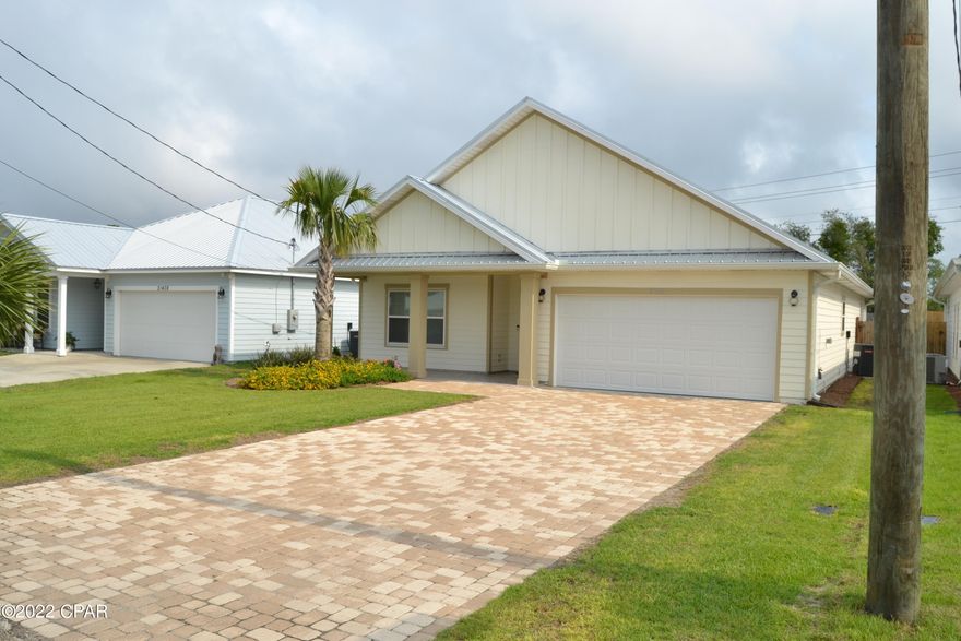 Your paradise awaits at 21404 Marlin Ave!!! This 3 bedroom 2 bath home looks and feels like BRAND NEW and comes completely furnished.   Imagine being able to walk to the beach from your new home. The interior of the home is bright, light and airy and the open concept feels like a HUGE space.  The bright white tile, crown molding, custom cabinets and kitchen island come straight out of HGTV.  The master suite is massive and features a glass enclosed shower, double vanity and walk in closet.  Both bedrooms 2 and 3 are extra large too and share a full bath. The back patio leads to a fenced, landscaped back yard and a 2 car garage stores your vehicles and beach toys.   The exterior of the home is hardie plank type siding with a metal roof too!   Come see your next home today This home is perfect for a short term rental.  You can stay when you want and rent it when you are not there!    The additional upgrades on this home are numerous:  R38 attic insulation, low E windows, tile back splash, soft close doors in the kitchen cabinets, granite counter tops too!  Interest rates are still in your favor whether you want to enjoy it for yourself or capitalize on short term rental opportunities.  Hurry before that opportunity changes. The furniture and the golf cart are worth $45,000 to $50,000