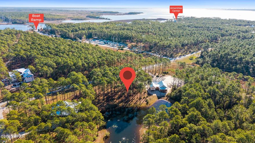 WATERFRONT LOT IN RIVERCAMPS:  Make your new home in RiverCamps—Panama City Beach's premier waterfront preserve community with 1,500 acres of natural beauty and over 1,000 acres of it dedicated to conservation. This homesite sits on a peaceful POND with full WATER views, offering one of the most desirable settings in the neighborhood.  This particular pond only has five homesites around it and backs up to some of the preservation area.

RiverCamps is bordered by Crooked Creek, West Bay, and the Intracoastal Waterway, with a private community boat ramp providing quick access to the Gulf. Enjoy endless outdoor activities including boating, fishing, paddleboarding, hiking, and birdwatching across miles of preserved trails and shoreline.

Amenities include gated access,zero-entry pool and pavilion,  day-use boat slips, dry storage, pickleball courts, campfire/glamping tents, and a new fitness center coming in 2026. Located just minutes from the new hospital, world-class beaches, and Pier Park, and the Northwest Florida Beaches International Airport (ECP).  RiverCamps offers unmatched tranquility with exceptional convenience.