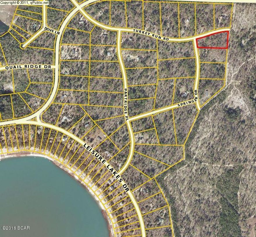 Wooded corner lot in Gated Community.  Access to Leisure Lakes and all amenities.