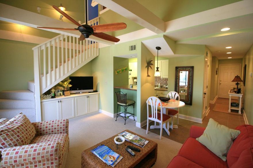 This Charming & Completely updated condo is definitely one of a kind. The owner has spared no expense with decorative details. Master bedroom and full bath located on the first floor and the staircase leads you up to a large loft type bedroom and full bath located on the second floor. The living room has beautiful vaulted ceilings with exposed beams, decorative lighting, a built in bookcase w/tv shelf and there's a sofa sleeper. The oversize patio overlooks the community pool, common ground and the shuffle board field.A/C unit 2 ton.Windows have been tinted.Additional 30 gal water heater upstairs.6 panel Masonite doors.Stackable washer & dryer.Building roof is 3 years old.Updated berber carpeting.