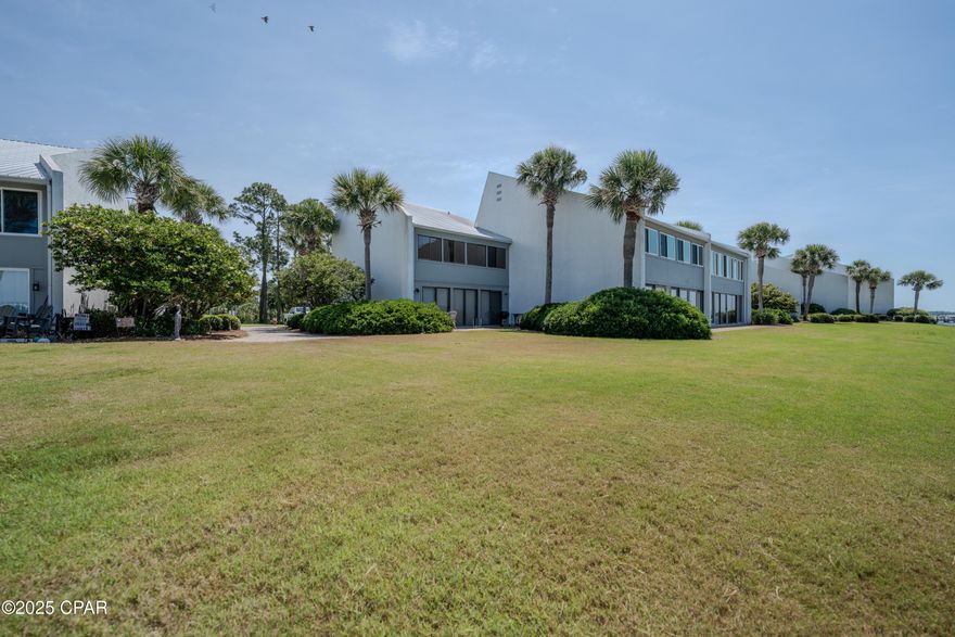 Waterfront 2 bedroom Bay Point Bayview Condo.  Awesome views of Grand Lagoon with sunsets.  Has boat dock and ability to keep boat.  Front deck is covered with views of a pond and golf course.  Flooring has been updated with no carpet in the unit.  This two bedroom is being sold fully furnished.  Previous owner had a bunk closet off the sunporch if needed.  Air conditioner replaced last summer.