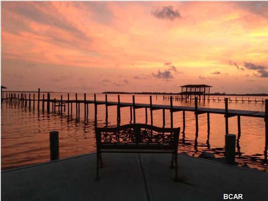 On the Bay, and completely updated first floor condo. This 2 bedroom 2 bath has updated tile floors, granite counter tops, stainless steel appliances, adequate storage,  updated bathrooms and fabulous views.  Ask about having your on boat slip sold separately to be added to this awesome Bay front complex.  You can be at Shell Island in 5 minutes or to the Gulf.  Two swimming pools, one bay front, a fishing station, private beach, and a community room for your use.  Do Not miss this opportunity to purchase this beautiful unit.