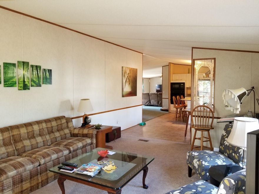 Currently under contract, seller accepting backup offers. This large home in a security gated community with amenities is ready for a big family. It 4 bedrooms, 2 bathrooms, eat-in kitchen with an island, separate formal dining room, a living room, den, utility room and pantry under a new metal roof. The kitchen is new with Corian countertops, undermount sink, lots of white cabinets with adjustable pullout drawers, and more cabinets under the island. There is privacy on the 2.5 acre corner lot and has a 20x30 metal building with a concrete floor and rollup door. It has its own electrical panel service box with room for more breakers. The master bedroom has 2 closets. The master bathroom was gutted, new step-in shower, bidet, toilet, sink, cabinets and lighting.