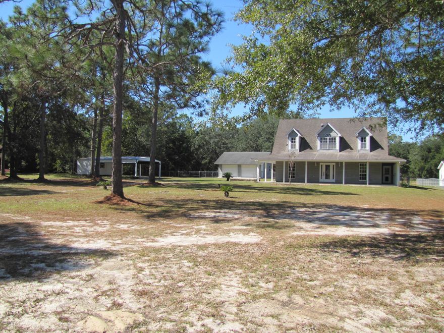 COUNTRY LIVING AT IT’S FINEST.  SITUATED ON 1.249 ACRES, THIS HOME HAS IT ALL.  PLENTY OF ROOM FOR A GROWING FAMILY.  3 BEDROOMS 2 ½ BATHS. JUST UNDER 2000 SQUARE FEET. LARGE MASTER BEDROOM ON THE FIRST FLOOR, FEATURES A GREAT SIZED BATHROOM WITH JACUZZI TUB AND LARGE WALK IN SHOWER. WALK IN CLOSET THAT HAS A WINDOW FOR LOTS OF NATURAL LIGHT.  THE ENTIRE FIRST FLOOR IS CERAMIC TILE.  KITCHEN HAS HAD NEW GRANITE CONTERTOPS, CERAMIC BACKSPLASH, APRON/FARM SINK, DISHWASHER, AND A JENN AIR DOWNDRAFT OVEN/STOVE.  BREAKFAST NOOK AND A SEPARATE DINING ROOM. THE LIVING ROOM CEILING SOARS TO 16 FEET.  UPSTAIRS THERE ARE TWO BEDROOMS AND A FULL BATH. ALL OF THE SECOND FLOOR HAS HAD NEW CARPETING INSTALLED ALONG WITH THE STAIRS.  THE ENTIRE HOUSE HAS BEEN PAINTED INSIDE AND OUT.  ALL YOU NEED TO D IS PACK YOUR BAGS AND PLAN THE MOVE.  OUTSIDE YOU WILL ENJOY THE OVERSIZED COVERED PATIO AREA DONE BY HORIZON.  IN ADDITION TO THE OVERSIZED DETACHED TWO CAR GARAGE, YOU WILL FIND 2 SEPARATE BUILDINGS FOR EVEN MORE STORAGE.  ONE IS A BASIC METAL BUILDING AND THE OTHER IS FINISHED AND HAS ROUGHLY A 4 CAR CARPORT.  LARGE POLE BARN FOR RV/BOAT PARKING.  THE BACK YARD IS COMPLETELY FENCED.   CALL TODAY AND MAKE YOUR APPOINTMENT TO SEE THIS LOVELY HOME.
